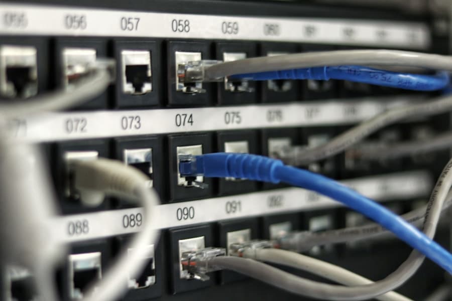 CAT 6 ethernet cables in a labeled network patch panel